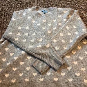 Grey sweater with white hearts super soft! size medium but is pretty oversized